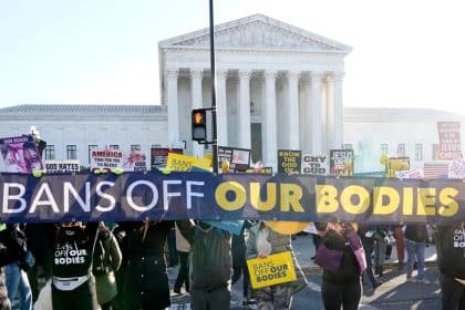 Justices Signal They’ll OK New Abortion Limits, May Toss Roe