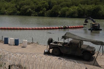 Biden Administration Sues Abbott Over Rio Grande Buoy Barrier Meant to Stop Migrants