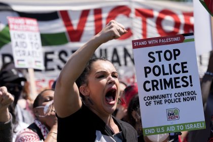 Some Protesters Tear Down Security Fence as Thousands March Outside Democratic National Convention